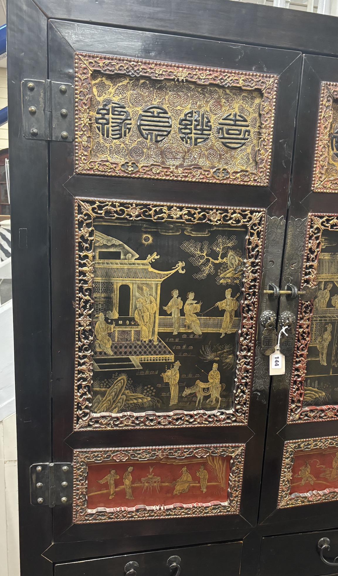 A Chinese lacquered side cabinet, width 109cm, depth 50cm, height 203cm